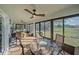 Relaxing sunroom with glass doors and view of backyard at 8755 Dolomite Ave, North Port, FL 34287