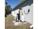 Exterior water system with filtration and pressure tank at 8755 Dolomite Ave, North Port, FL 34287