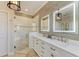 Bathroom with double vanity, frameless shower, and modern finishes at 8912 Heritage Sound Dr, Bradenton, FL 34212