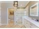 Spa-like bathroom with a glass shower, double vanity, and modern fixtures at 8912 Heritage Sound Dr, Bradenton, FL 34212
