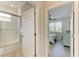 Bathroom with shower and tub, updated vanity, and tile flooring at 8912 Heritage Sound Dr, Bradenton, FL 34212