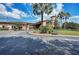 Community clubhouse with inviting landscaping and golf cart parking at 8912 Heritage Sound Dr, Bradenton, FL 34212
