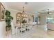 Bright dining room with a rustic wooden table and chandelier at 8912 Heritage Sound Dr, Bradenton, FL 34212