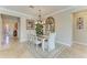 Elegant dining room with a formal table setting and entryway view at 8912 Heritage Sound Dr, Bradenton, FL 34212