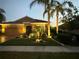 Charming single-story home with attractive landscaping and nighttime lighting at 8912 Heritage Sound Dr, Bradenton, FL 34212