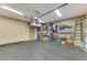 Spacious garage with overhead storage and floor-to-ceiling shelving at 8912 Heritage Sound Dr, Bradenton, FL 34212