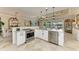 Open kitchen with island, stainless steel appliances, and granite countertops at 8912 Heritage Sound Dr, Bradenton, FL 34212
