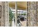 View of a relaxing lanai with patio furniture, overlooking a pond at 8912 Heritage Sound Dr, Bradenton, FL 34212