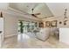 Relaxing living room featuring neutral furniture and large sliding doors at 8912 Heritage Sound Dr, Bradenton, FL 34212