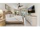 Serene main bedroom with king-size bed and access to patio at 8912 Heritage Sound Dr, Bradenton, FL 34212