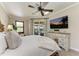 Main bedroom with king-size bed and stunning sunset view at 8912 Heritage Sound Dr, Bradenton, FL 34212