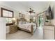 Comfortable main bedroom with a king-size bed and private access to patio at 8912 Heritage Sound Dr, Bradenton, FL 34212