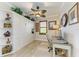 Home office with built-in shelving, desk, and ceiling fan at 8912 Heritage Sound Dr, Bradenton, FL 34212
