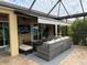 Outdoor living space featuring a screened lanai with comfortable seating at 8912 Heritage Sound Dr, Bradenton, FL 34212