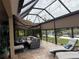 Spacious screened lanai overlooking a tranquil lake, perfect for outdoor relaxation at 8912 Heritage Sound Dr, Bradenton, FL 34212