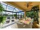Spacious screened patio with outdoor dining and lounge areas at 8912 Heritage Sound Dr, Bradenton, FL 34212