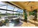 Relaxing screened patio with seating area and water views at 8912 Heritage Sound Dr, Bradenton, FL 34212