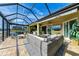 Spacious screened patio with comfortable seating and water views at 8912 Heritage Sound Dr, Bradenton, FL 34212
