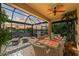 Large screened patio featuring a dining area and water views at 8912 Heritage Sound Dr, Bradenton, FL 34212