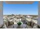 Expansive city views from a private balcony with seating at 111 S Pineapple Ave # 1102, Sarasota, FL 34236