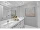 Modern bathroom with double vanity and walk-in shower at 111 S Pineapple Ave # 1102, Sarasota, FL 34236