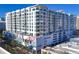 Modern high-rise building with city views and unique mural at 111 S Pineapple Ave # 1102, Sarasota, FL 34236