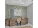 Modern home office with built-in desk and mirrored accent wall at 111 S Pineapple Ave # 1102, Sarasota, FL 34236