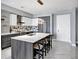 Modern kitchen with island and geometric backsplash at 111 S Pineapple Ave # 1102, Sarasota, FL 34236