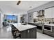 Modern kitchen with island and stainless steel appliances at 111 S Pineapple Ave # 1102, Sarasota, FL 34236