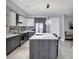 Modern kitchen with island and stainless steel appliances at 111 S Pineapple Ave # 1102, Sarasota, FL 34236