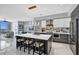 Modern open concept kitchen with breakfast bar at 111 S Pineapple Ave # 1102, Sarasota, FL 34236