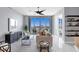 Spacious living room with city views and modern furnishings at 111 S Pineapple Ave # 1102, Sarasota, FL 34236