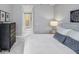 Main bedroom with a dresser and ensuite bathroom access at 111 S Pineapple Ave # 1102, Sarasota, FL 34236