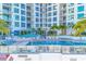 Luxury building with refreshing pool and ample seating at 111 S Pineapple Ave # 1102, Sarasota, FL 34236