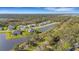 Aerial view of a luxury community with lakefront homes and lush landscaping at 15808 42Nd E Gln, Parrish, FL 34219
