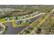 Aerial view showcasing a single-Gathering home with a backyard and lake access at 15808 42Nd E Gln, Parrish, FL 34219