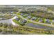 An aerial view of a house nestled in a quiet community by the lake at 15808 42Nd E Gln, Parrish, FL 34219