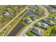 Aerial view of a house and neighborhood with a pond at 15808 42Nd E Gln, Parrish, FL 34219