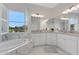 Spacious bathroom with a corner vanity and a view at 15808 42Nd E Gln, Parrish, FL 34219