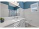 Bright bathroom with white cabinets and a quartz countertop at 15808 42Nd E Gln, Parrish, FL 34219