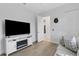 Bedroom with built-in fireplace, large TV and access to the bathroom at 15808 42Nd E Gln, Parrish, FL 34219