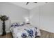 Guest bedroom with a floral comforter and white nightstand at 15808 42Nd E Gln, Parrish, FL 34219