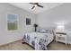 Bedroom with a floral comforter and a white nightstand at 15808 42Nd E Gln, Parrish, FL 34219