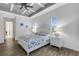 Main bedroom with white bed frame and wood flooring at 15808 42Nd E Gln, Parrish, FL 34219