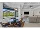 Breakfast nook with glass table and wicker chairs, overlooking the pool at 15808 42Nd E Gln, Parrish, FL 34219