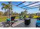 Spacious deck with pergola, fire pit, and lounge seating at 15808 42Nd E Gln, Parrish, FL 34219