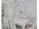 Elegant dining room featuring a farmhouse table and stylish light fixture at 15808 42Nd E Gln, Parrish, FL 34219