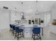 Modern kitchen with large island, stainless steel appliances, and blue barstools at 15808 42Nd E Gln, Parrish, FL 34219