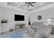 Bright living room with comfy sofas, a large TV, and access to a relaxing patio at 15808 42Nd E Gln, Parrish, FL 34219