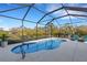 Relaxing screened pool area with lounge chairs and canal view at 15808 42Nd E Gln, Parrish, FL 34219
